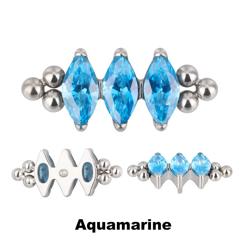 Anello in titanio con tre perline e castone