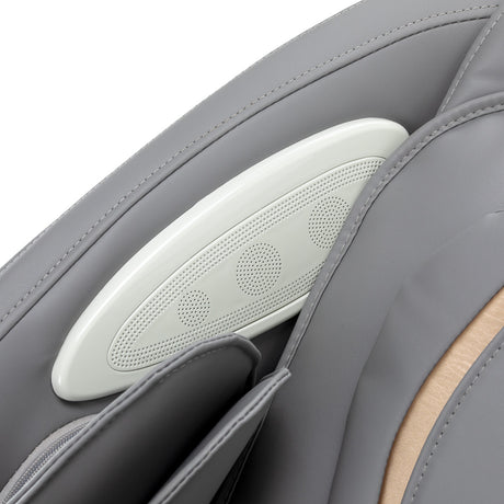 White and grey Sakura Maximus 809 3D massage chair showing sleek design and padded armrests in a modern massage furniture setting.