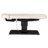 Cream SPA lounger Sillon Relax with black base, modern beauty salon furniture for comfortable client seating.