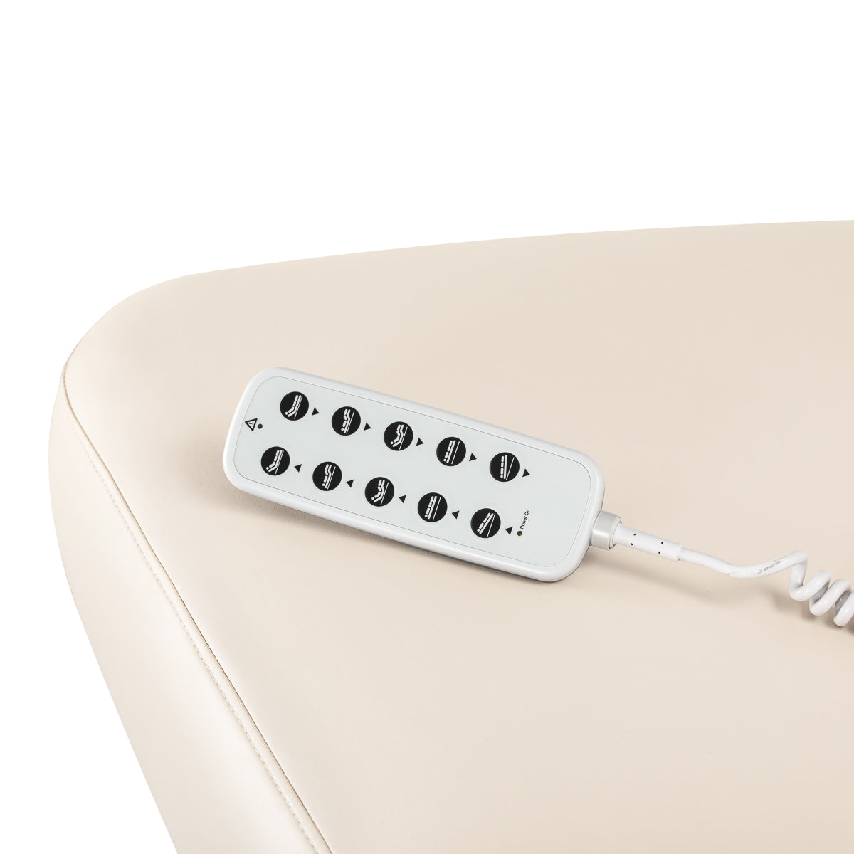 Cream-colored SPA lounger Sillon Comfort with light brown base, designed for beauty salon furniture, showcasing a comfortable reclining chair.
