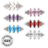 Anello in titanio con tre perline e castone