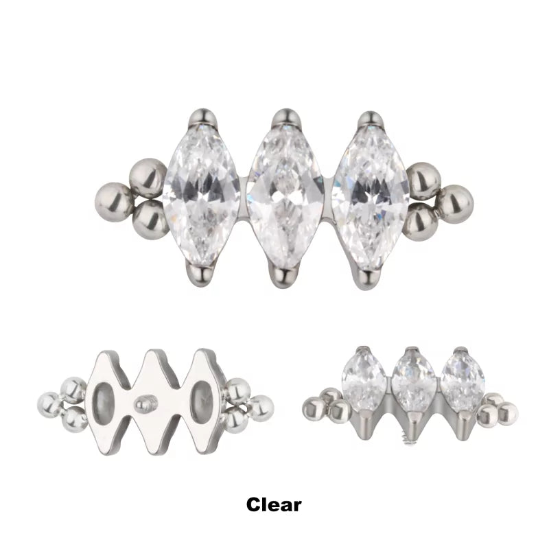 Anello in titanio con tre perline e castone